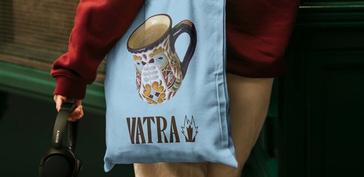 Vatra tote bag with the app's illustration and wordmark